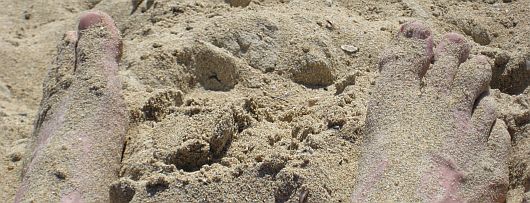 Sand-an-den-Fuessen